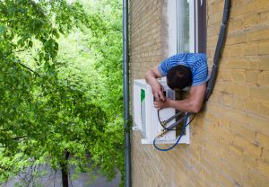 Man Installing AC to the House